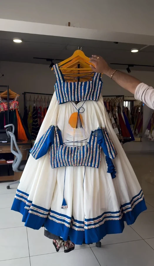 "Classic White Lehenga with Blue Embellished Blouse"