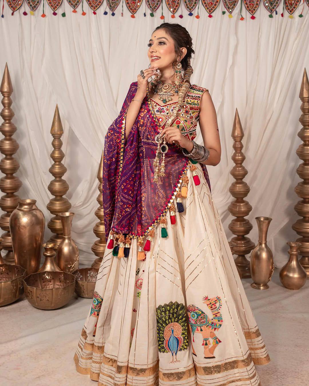 Regal Gujarati Mirror Work Navratri Lehenga Choli with Vibrant Embroidery & Peacock Motifs
