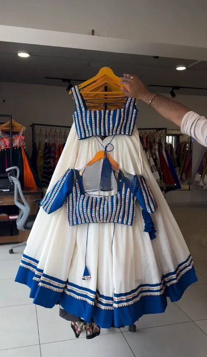 "Classic White Lehenga with Blue Embellished Blouse"